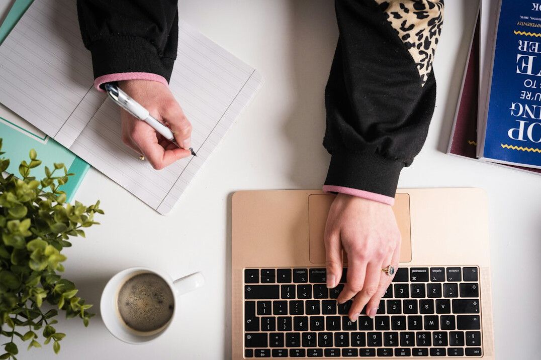 person planning investments on laptop