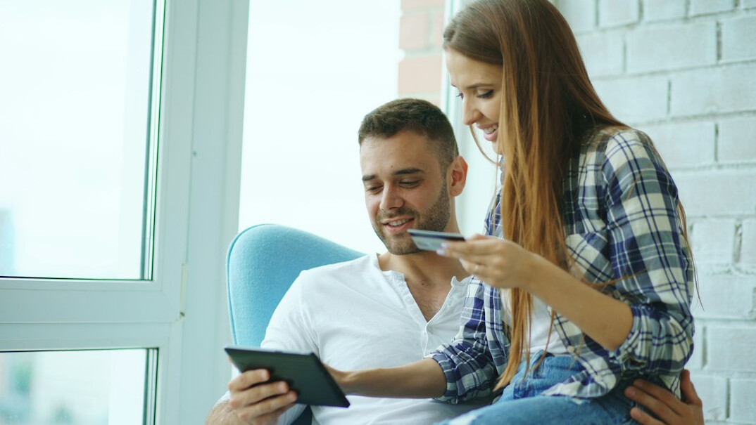 happy couple discussing finances